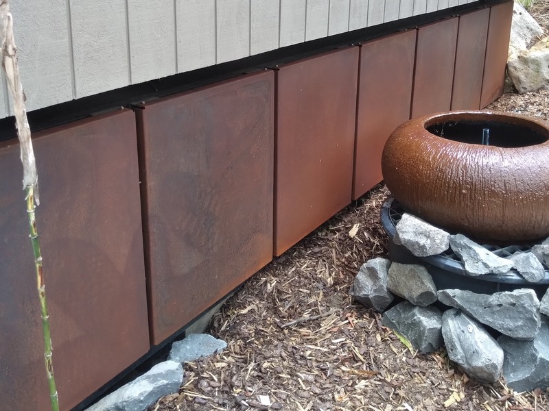 corten panels under house